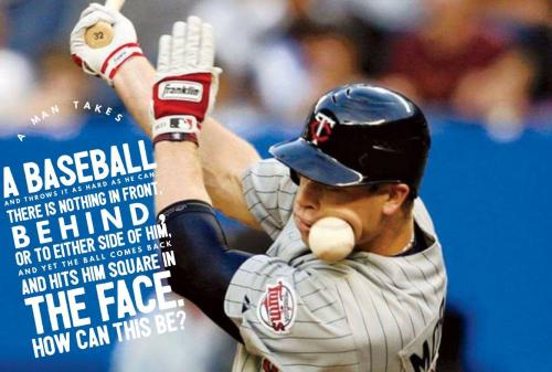 A man takes a baseball and throws it as hard as he can. There is nothing in front, behind, or to either side of him, and yet the ball comes back and hits him square in the face. How can this be?